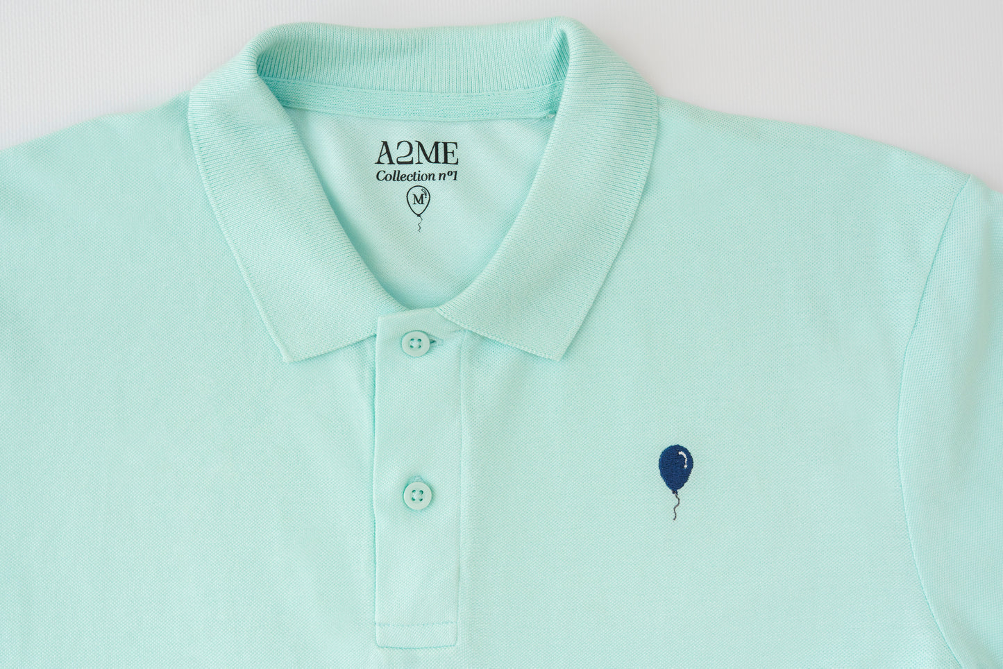 Polo VERDE AGUA globo azul