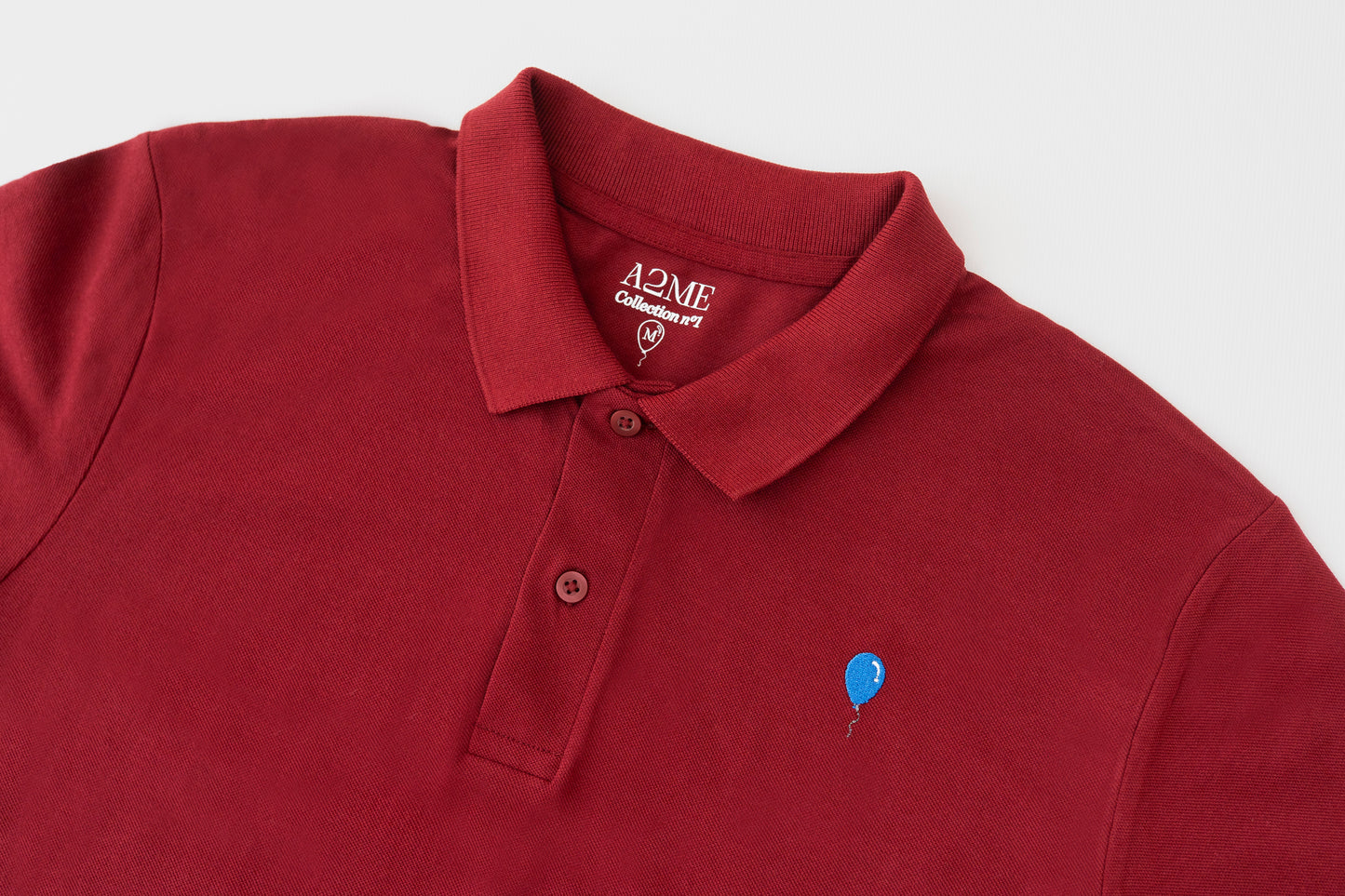 Polo BURDEOS globo azul.